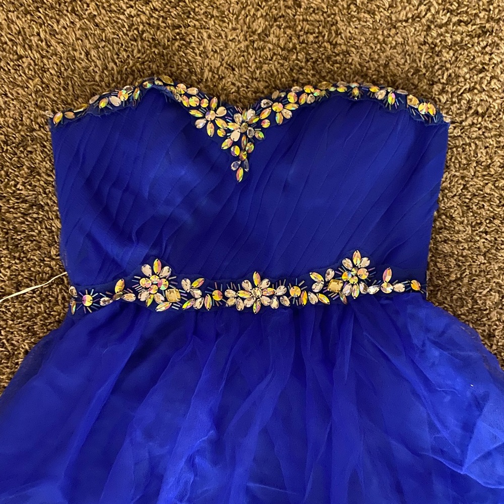 Beautiful embroidery jeweled,blue prom dress. Altered to fit a 5”1 person.